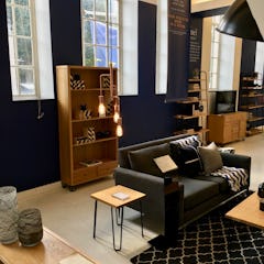 A bookcase and a sofa at Heal's