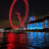 London Eye at night from a river cruise