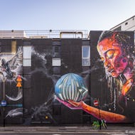 The bicycle shows the scale of this amazing mural by Mr Cenz and Lovepusher on New Inn Yard