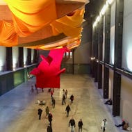 People walking in the Turbine Hall of Tate Modern